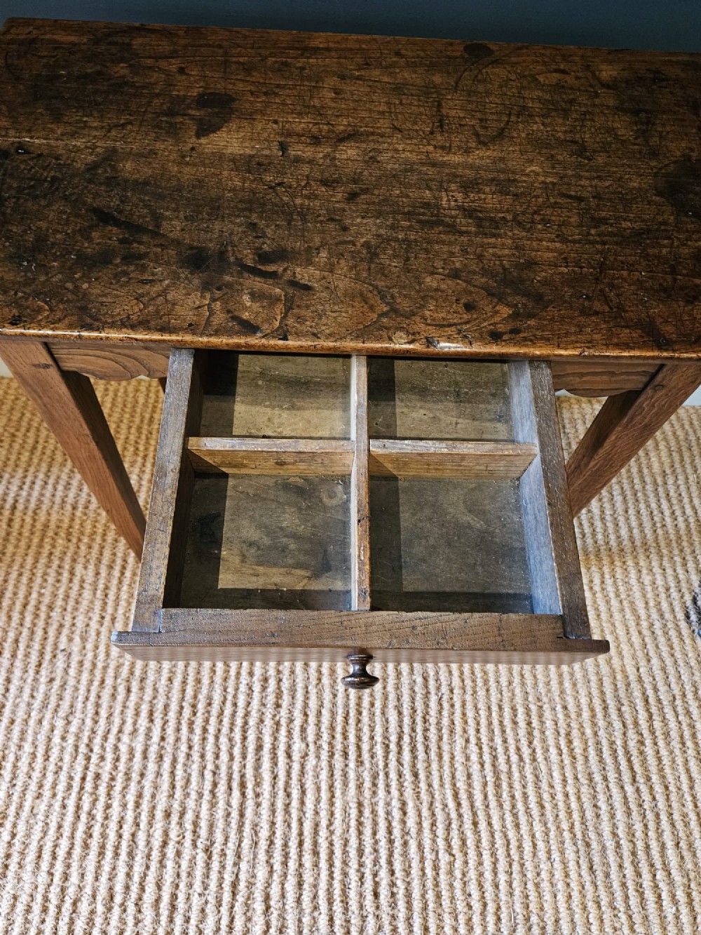 A George III elm single drawer side table featuring a rectangular top, a shaped apron, a turned wooden drawer knob, and tapered square legs. View VI
