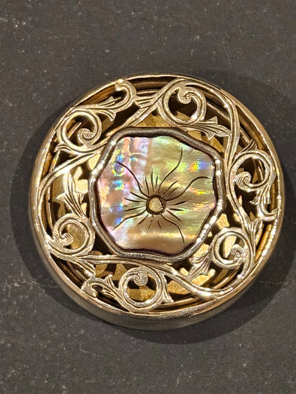 A circular Edwardian silver pot-pourri box featuring a pierced scrollwork lid set with a central mother-of-pearl floral inset. View IV