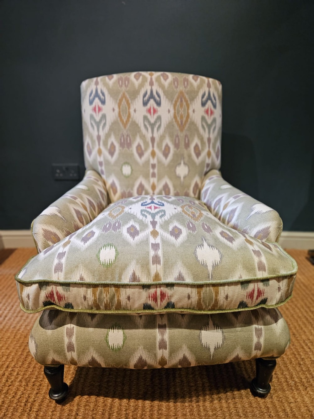 A pair of Victorian armchairs reupholstered in a geometric sage green ikat linen fabric with turned dark timber front legs. View IV