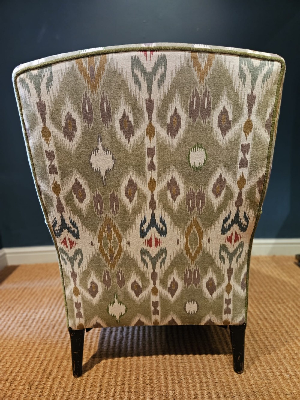 A pair of Victorian armchairs reupholstered in a geometric sage green ikat linen fabric with turned dark timber front legs. View VII