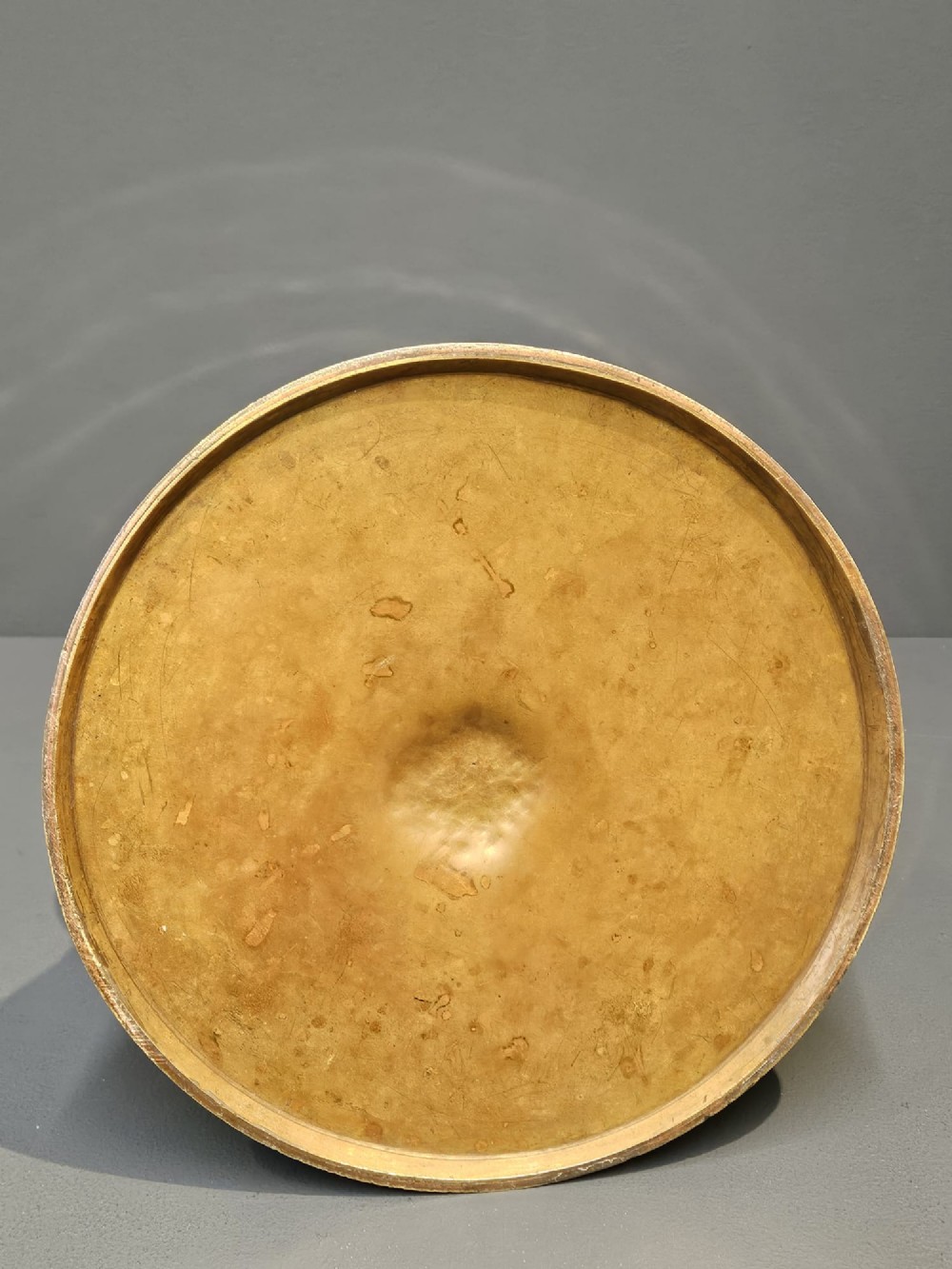 A polished Victorian brass one gallon capacity standard measure with a flared funnel top, conical body, twin loop handles, and official engravings. View V