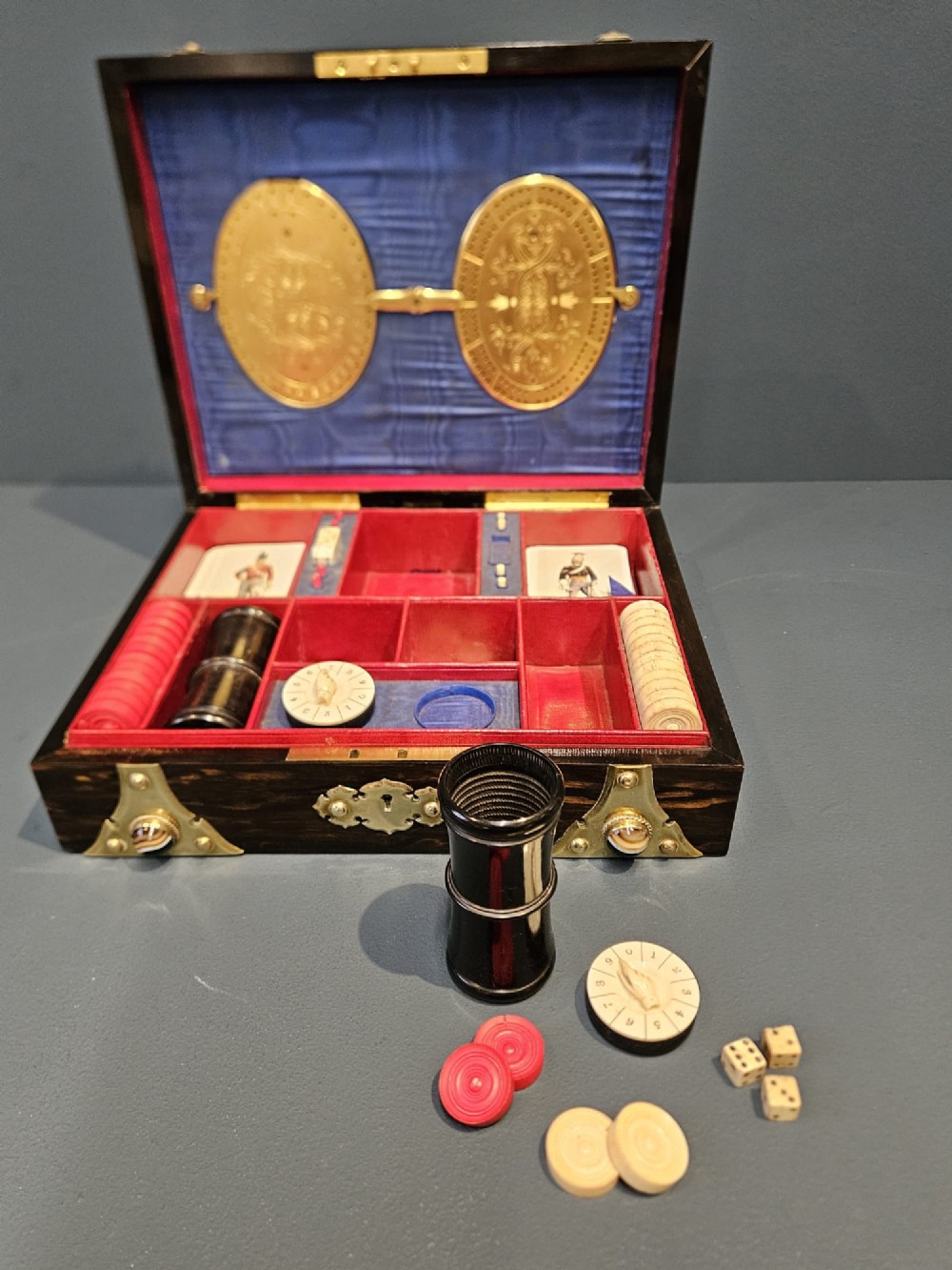 A dark coromandel wood box featuring decorative brass strapwork inset with rounded agate cabochons. View VIII