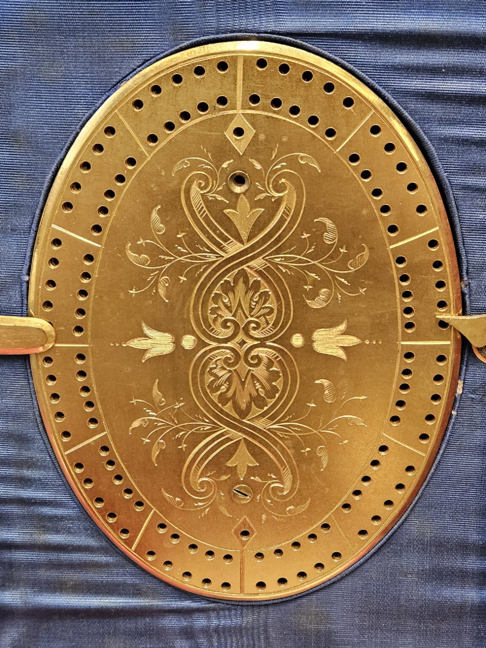 A dark coromandel wood box featuring decorative brass strapwork inset with rounded agate cabochons. View X