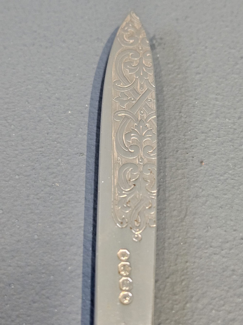 A Victorian silver and tortoiseshell paper knife featuring an engraved silver blade with hallmarks and an inlaid tortoiseshell handle. View IV