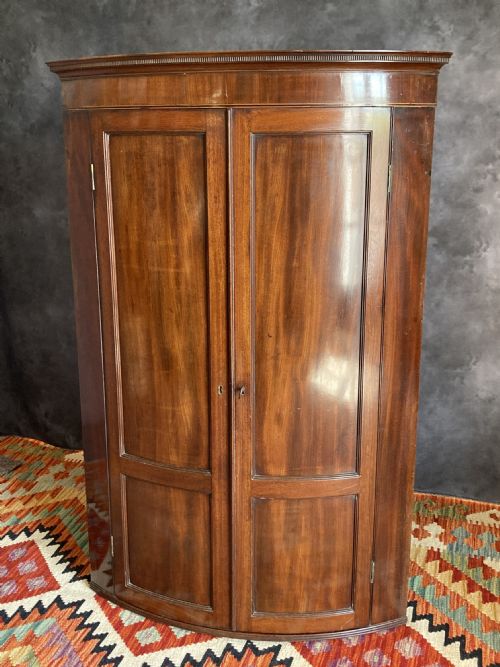 regency mahogany bow front hanging corner cupboard circa 1810 - CATEGORY: ANTIQUE CUPBOARDS - DATED GEORGIAN