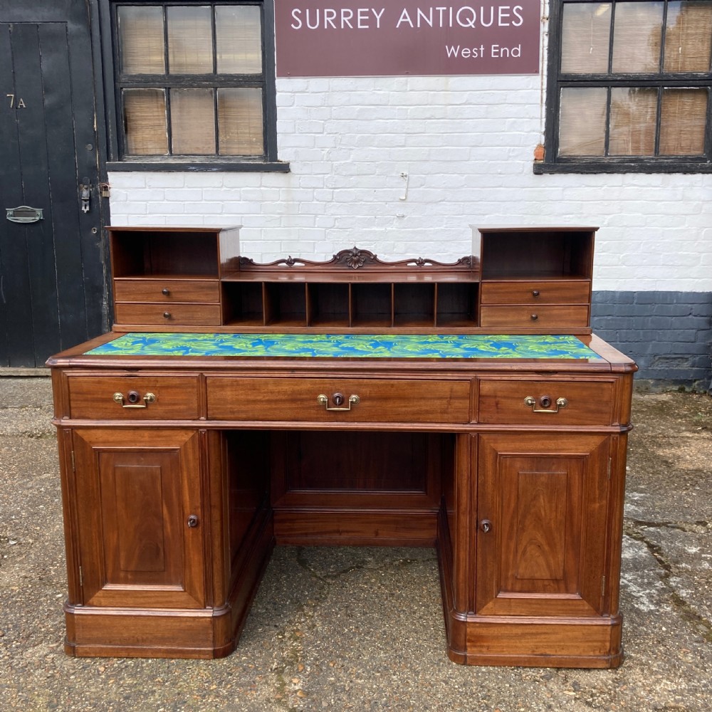 A mid-19th-century Italian mahogany pedestal desk featuring a raised superstructure with pigeonholes, frieze drawers, and twin pedestal cupboards. View II
