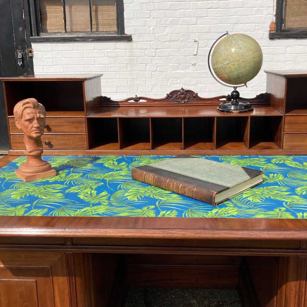 A mid-19th-century Italian mahogany pedestal desk featuring a raised superstructure with pigeonholes, frieze drawers, and twin pedestal cupboards. View III