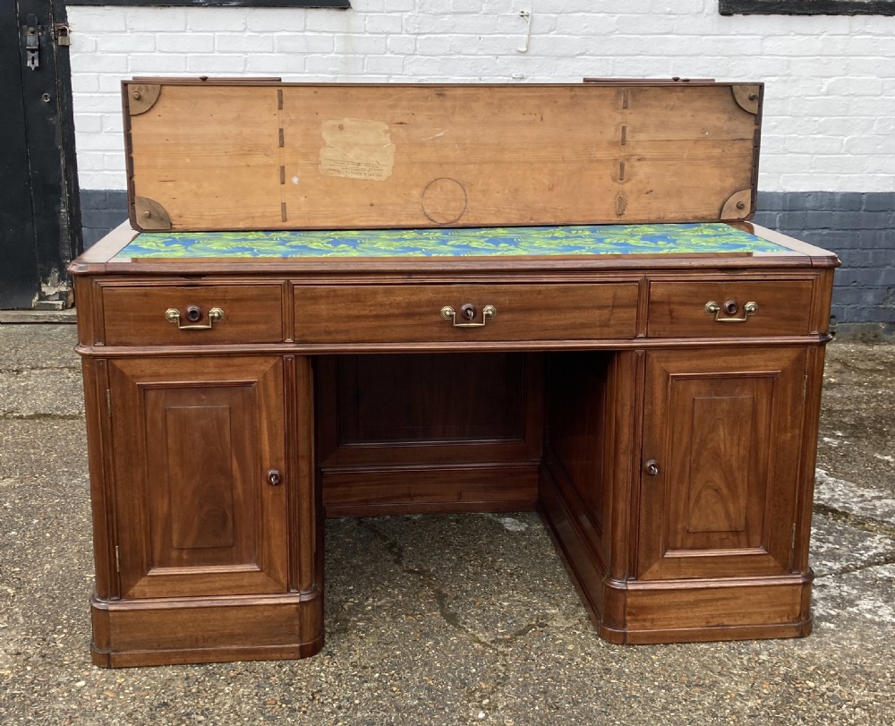 A mid-19th-century Italian mahogany pedestal desk featuring a raised superstructure with pigeonholes, frieze drawers, and twin pedestal cupboards. View XVII