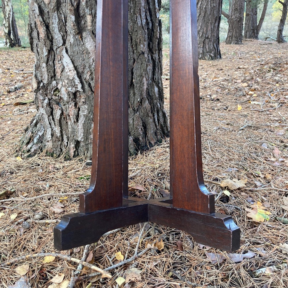 An antique Cotswold School octagonal rosewood occasional table featuring slender straight legs and a cross-shaped base. View VIII