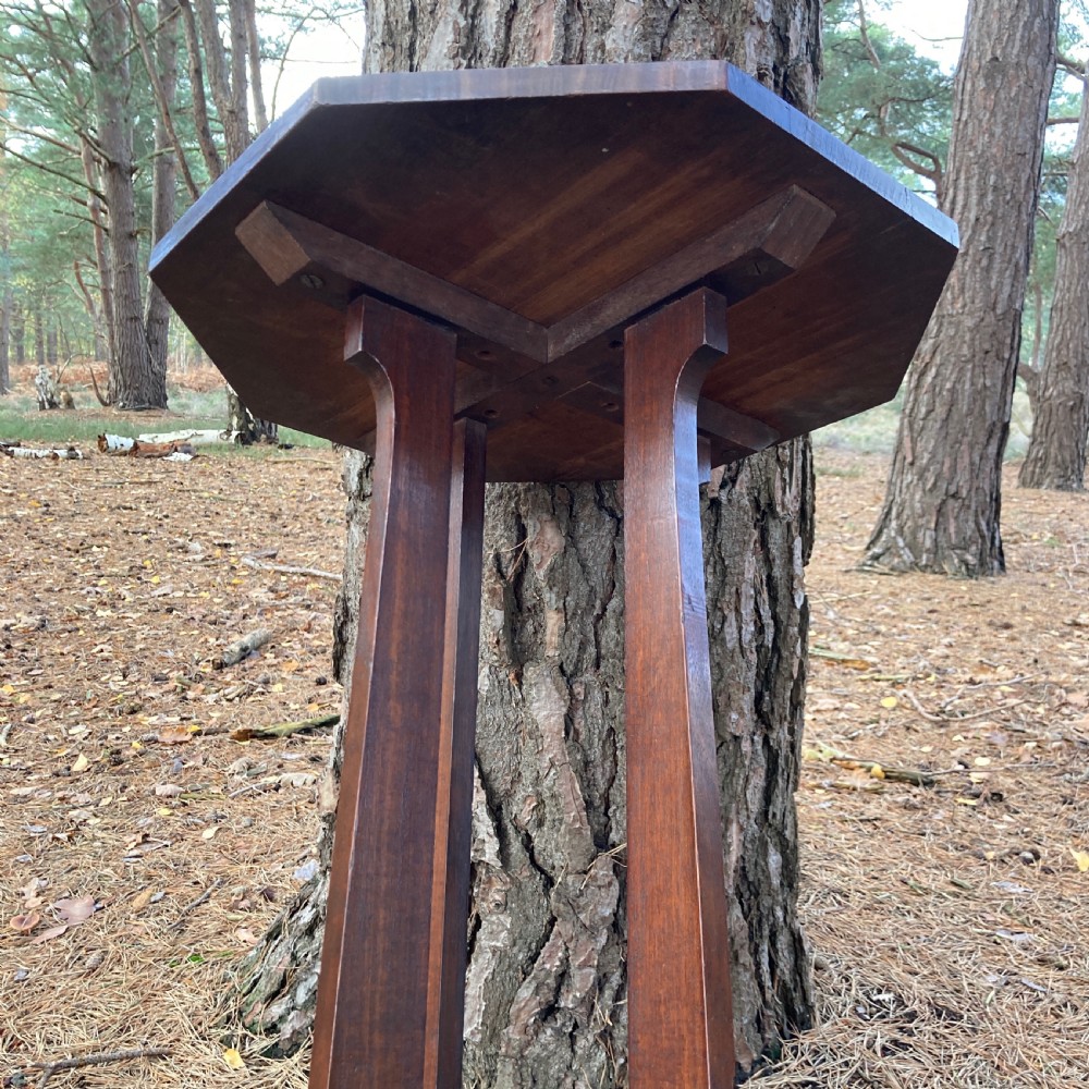 An antique Cotswold School octagonal rosewood occasional table featuring slender straight legs and a cross-shaped base. View IX