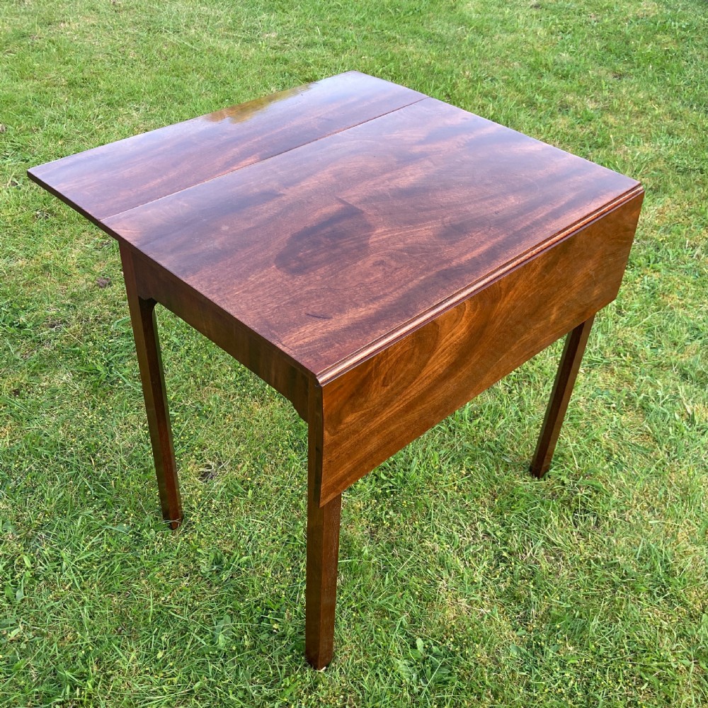 A Georgian mahogany Pembroke table featuring two drop-leaf sides and four square tapered legs. View II