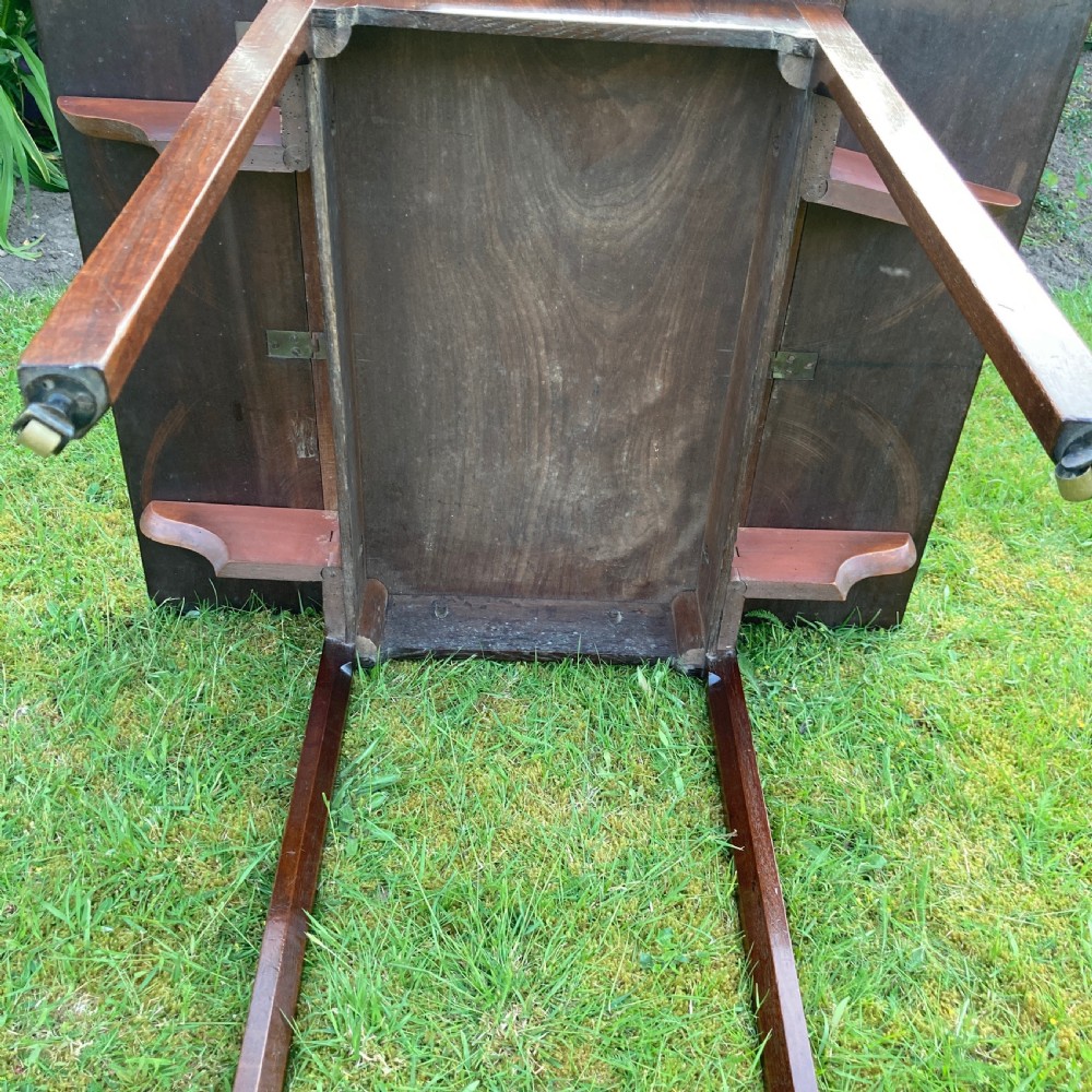 A Georgian mahogany Pembroke table featuring two drop-leaf sides and four square tapered legs. View VIII