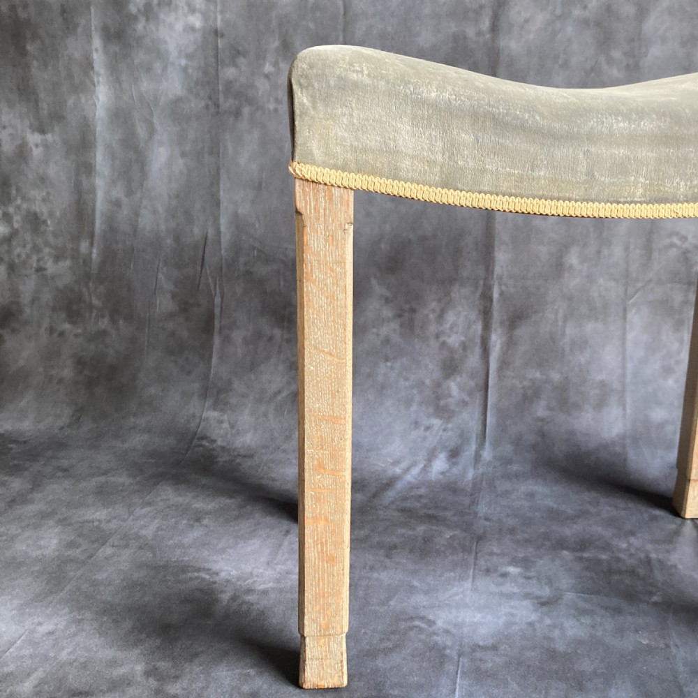 A 1937 King George VI coronation stool featuring a limed oak frame, chamfered legs, and a concave velvet seat edged with gold braid. View VIII