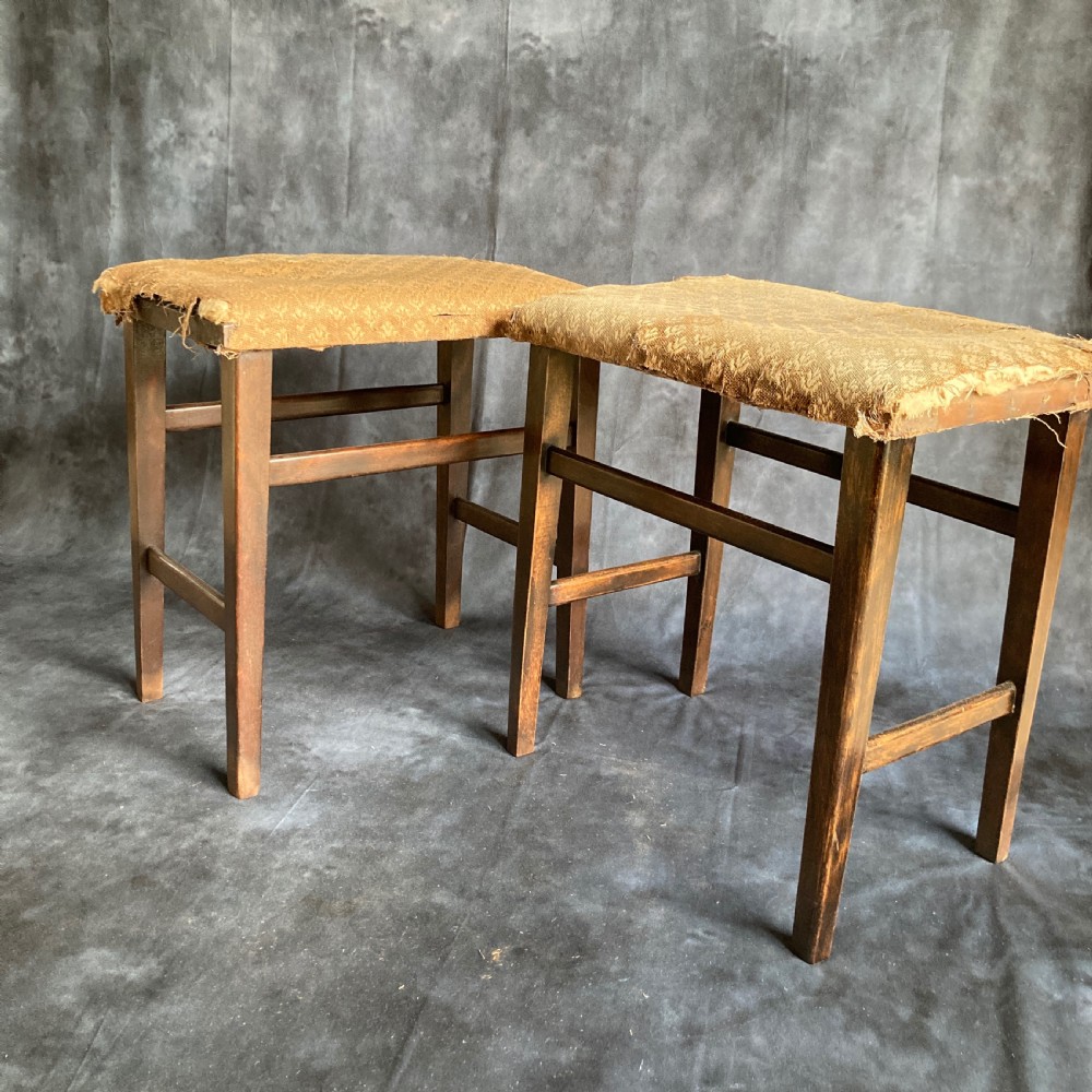 A pair of early 20th-century dark oak stools featuring patterned gold upholstery and rectangular tapered legs. View VIII