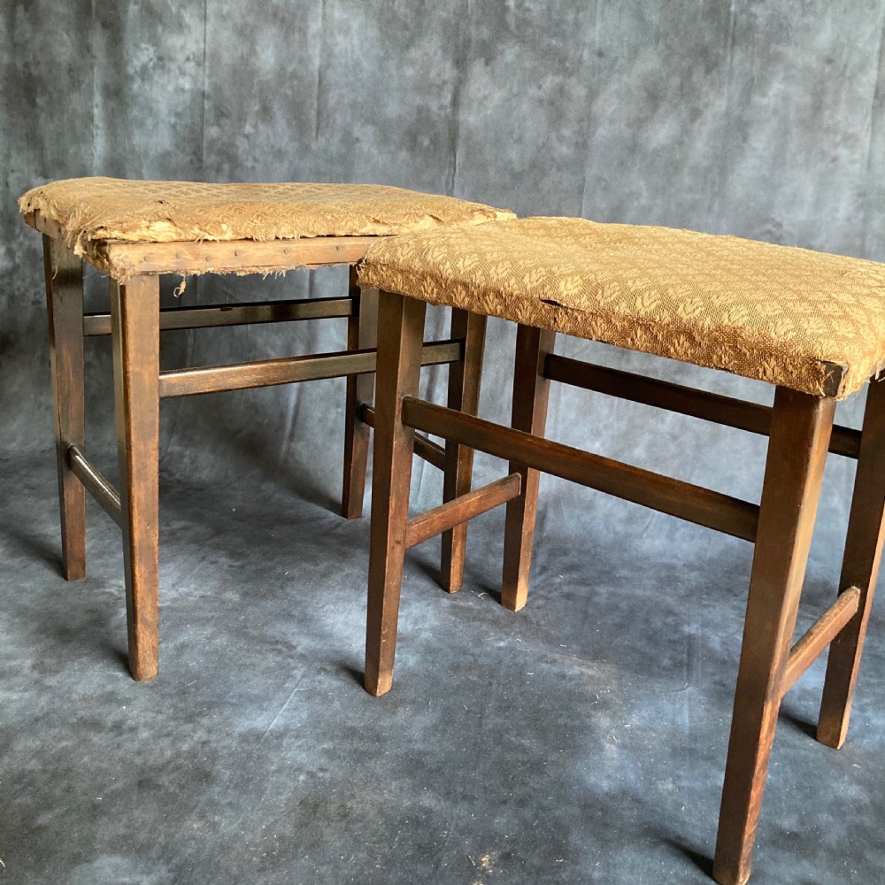A pair of early 20th-century dark oak stools featuring patterned gold upholstery and rectangular tapered legs. View IX