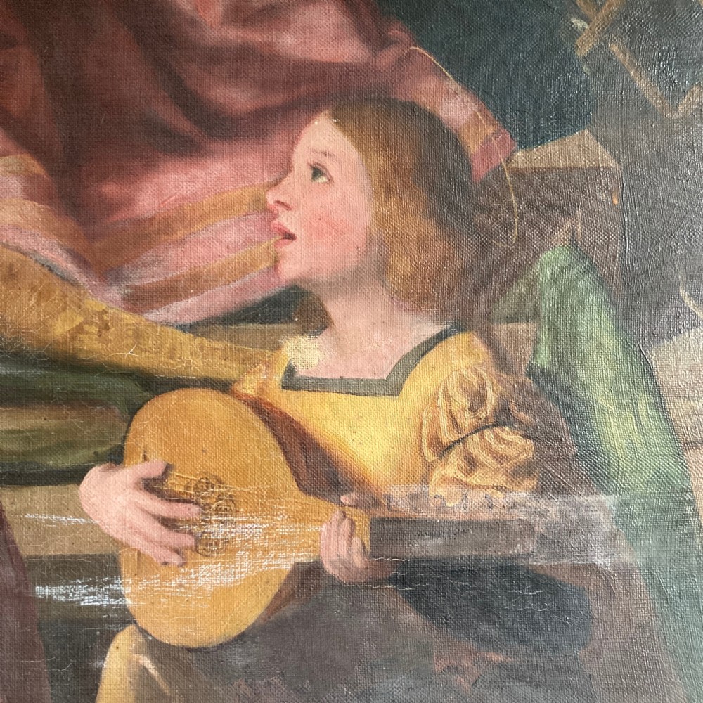 An antique oil painting on canvas depicting a winged angel in pink and teal robes playing a musical instrument. View IV