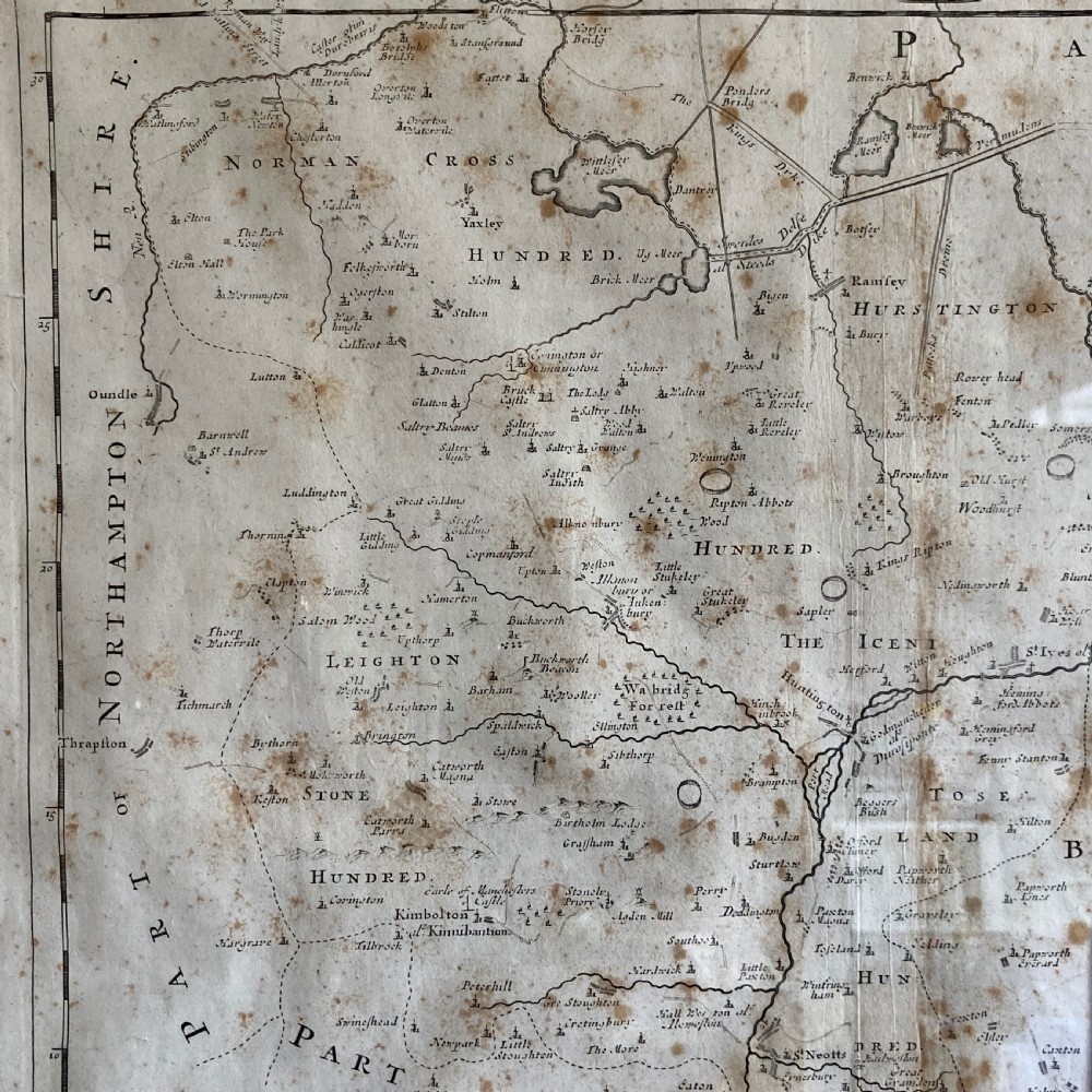 An 18th-century engraved map of Huntington Shire by Robert Morden, set within a cream mount and a dark wood frame with a gilt inner slip. View V