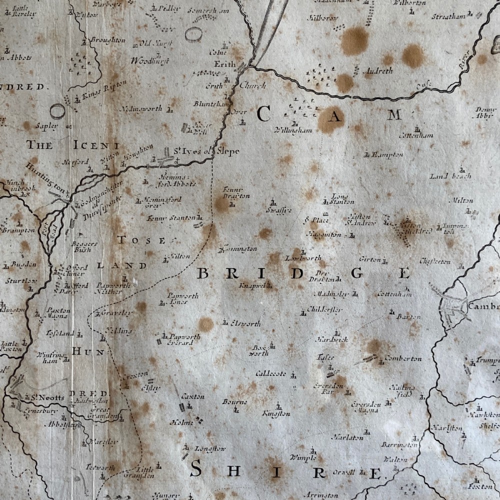 An 18th-century engraved map of Huntington Shire by Robert Morden, set within a cream mount and a dark wood frame with a gilt inner slip. View VII