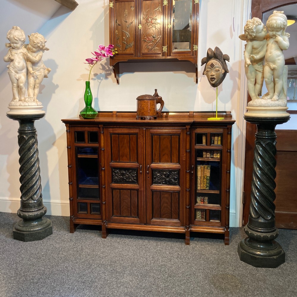 A pair of 19th-century French Neoclassical dark green serpentine marble pedestals with spiral-carved twist shafts. View V