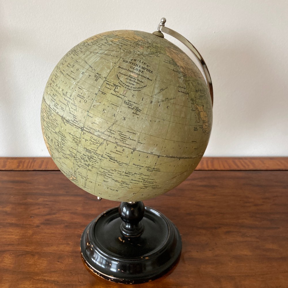 A 1930s Philips British Empire terrestrial desk globe mounted on a chrome semi-meridian and an ebonised wooden base. View II