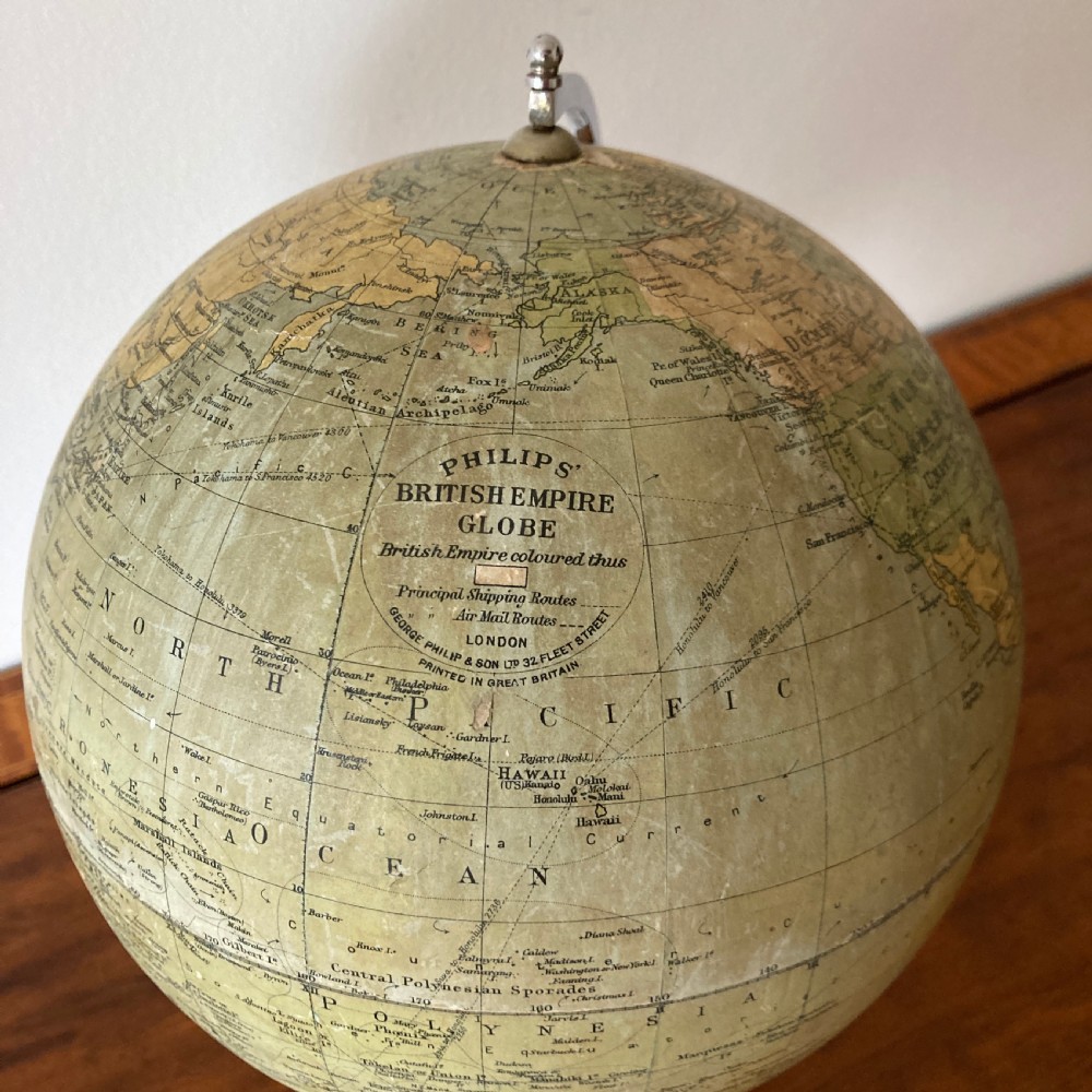 A 1930s Philips British Empire terrestrial desk globe mounted on a chrome semi-meridian and an ebonised wooden base. View VIII