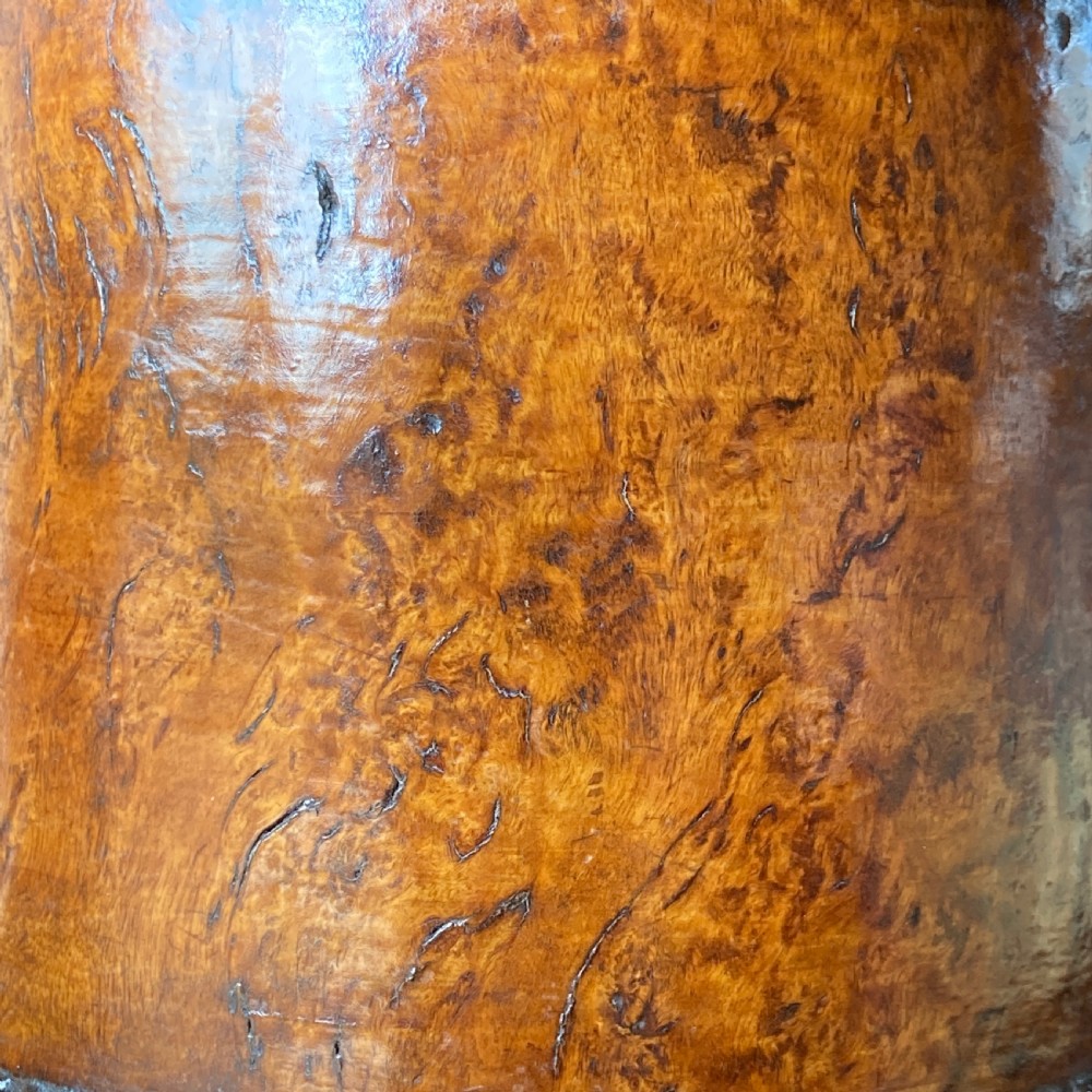 An 18th-century Norwegian carved wooden peg tankard featuring a lion thumbpiece, domed relief-carved lid, and carved lion feet in a warm brown finish. View XIII
