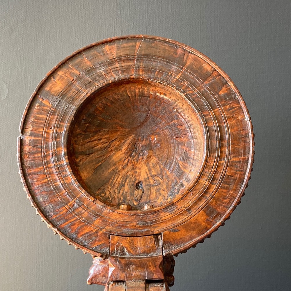 An 18th-century Norwegian carved wooden peg tankard featuring a lion thumbpiece, domed relief-carved lid, and carved lion feet in a warm brown finish. View XV