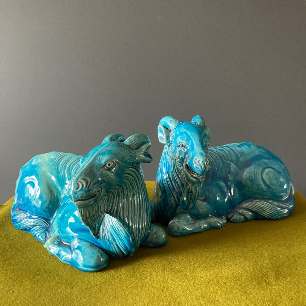 A pair of nineteenth-century Chinese porcelain recumbent goats featuring vibrant turquoise blue monochrome glazing and incised fur detailing. View II