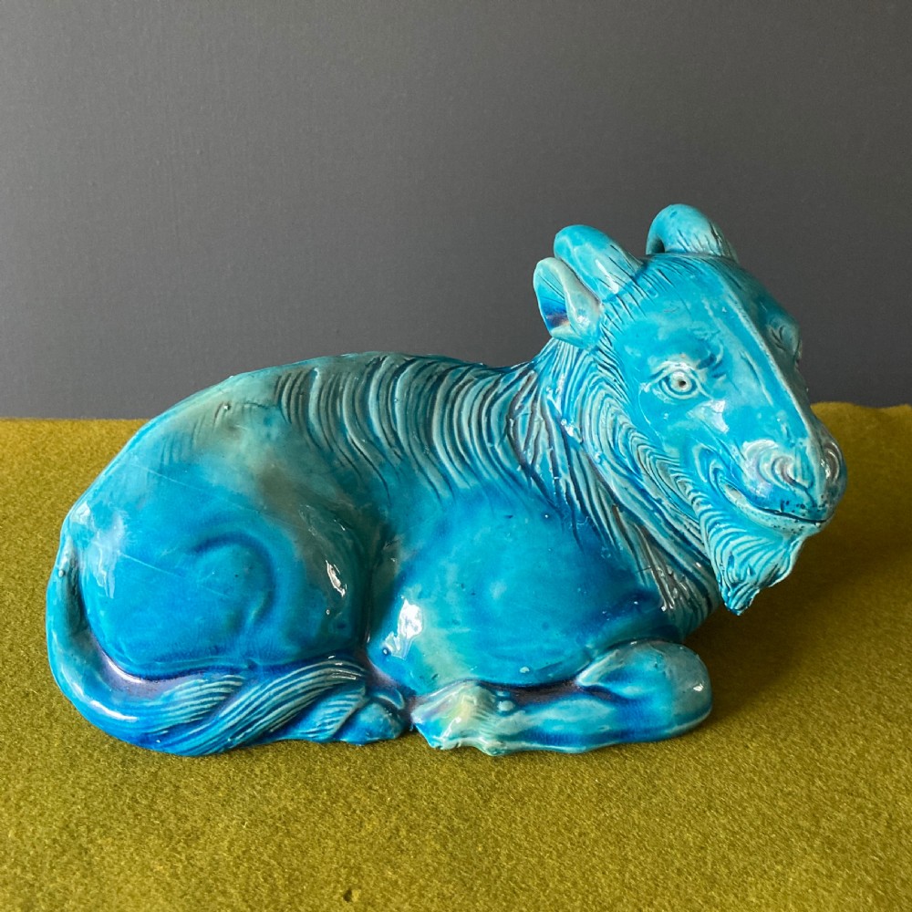 A pair of nineteenth-century Chinese porcelain recumbent goats featuring vibrant turquoise blue monochrome glazing and incised fur detailing. View III