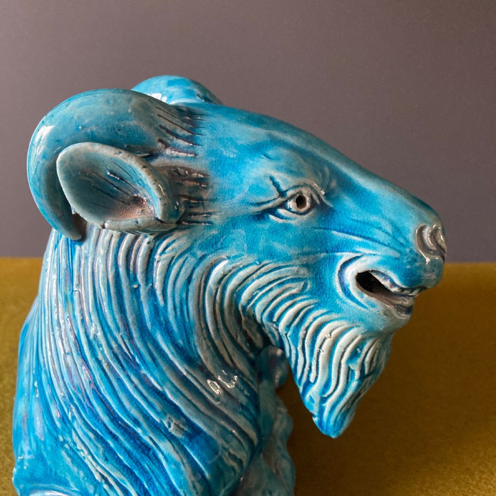 A pair of nineteenth-century Chinese porcelain recumbent goats featuring vibrant turquoise blue monochrome glazing and incised fur detailing. View VIII