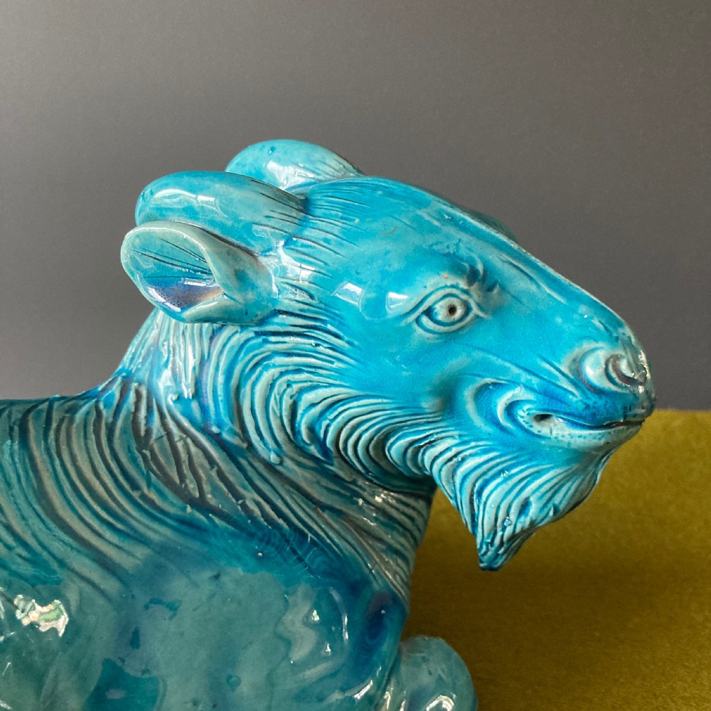 A pair of nineteenth-century Chinese porcelain recumbent goats featuring vibrant turquoise blue monochrome glazing and incised fur detailing. View XI