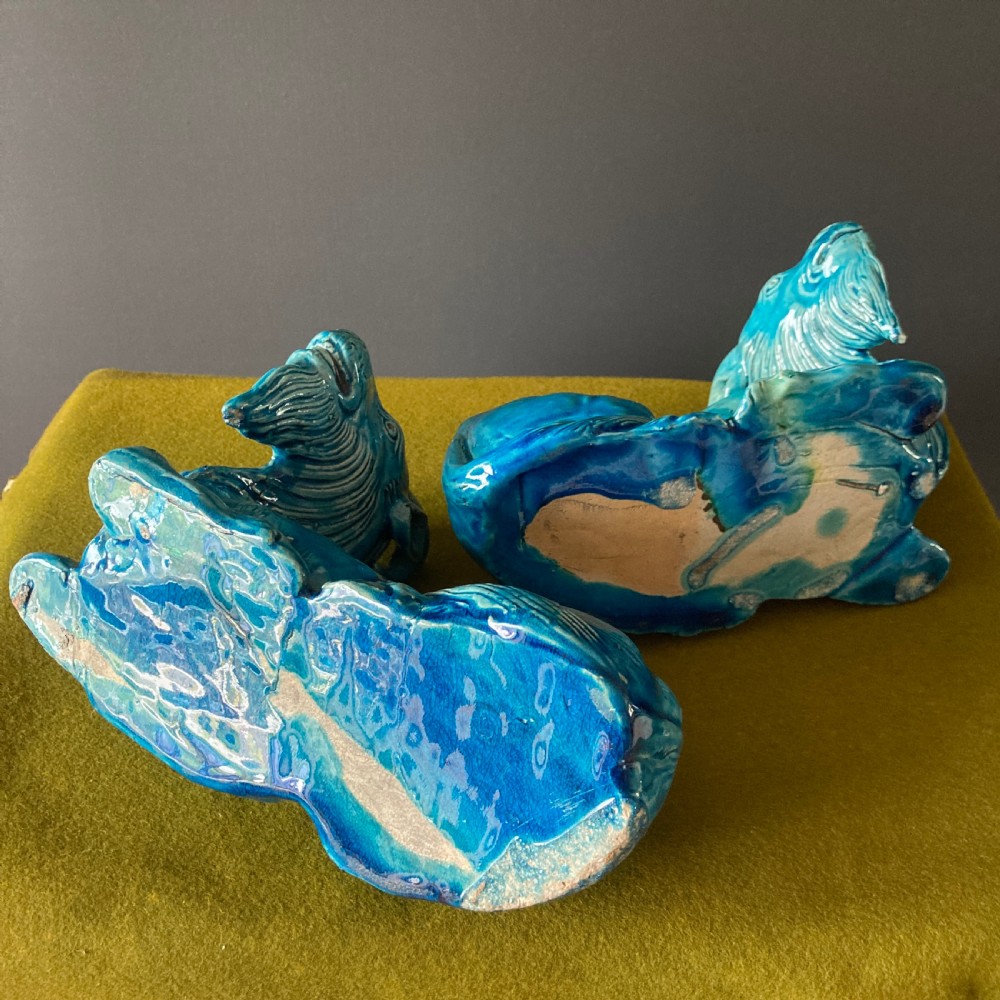 A pair of nineteenth-century Chinese porcelain recumbent goats featuring vibrant turquoise blue monochrome glazing and incised fur detailing. View XIV