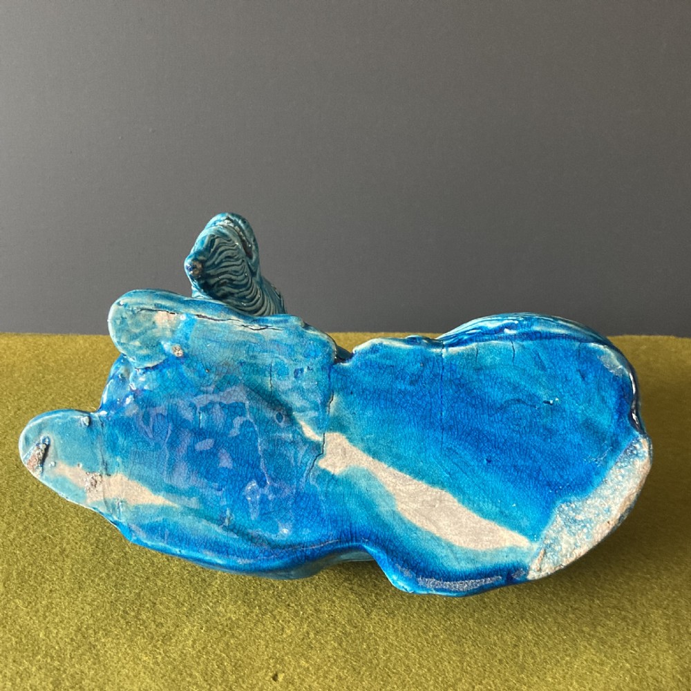 A pair of nineteenth-century Chinese porcelain recumbent goats featuring vibrant turquoise blue monochrome glazing and incised fur detailing. View XV