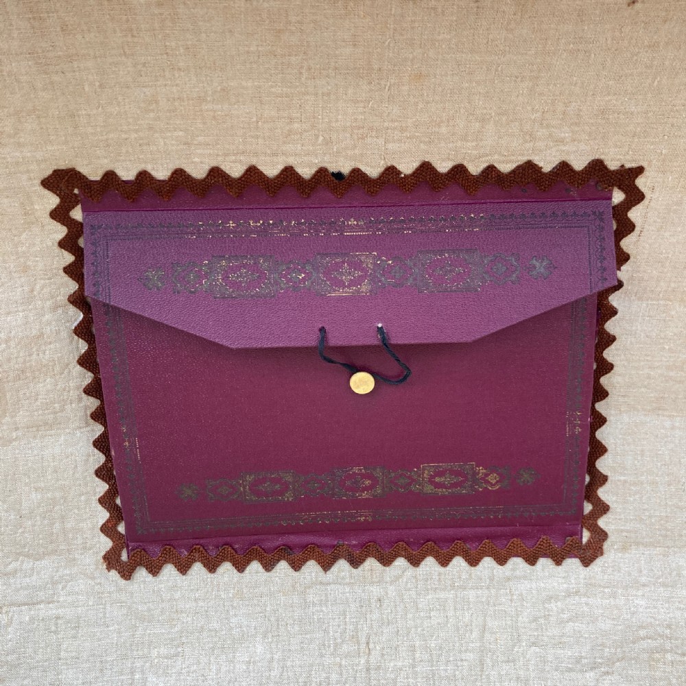 A late nineteenth-century domed steamer trunk with brown fabric covering, dark wooden banding, metal studs, and central brass lock hardware. View VIII