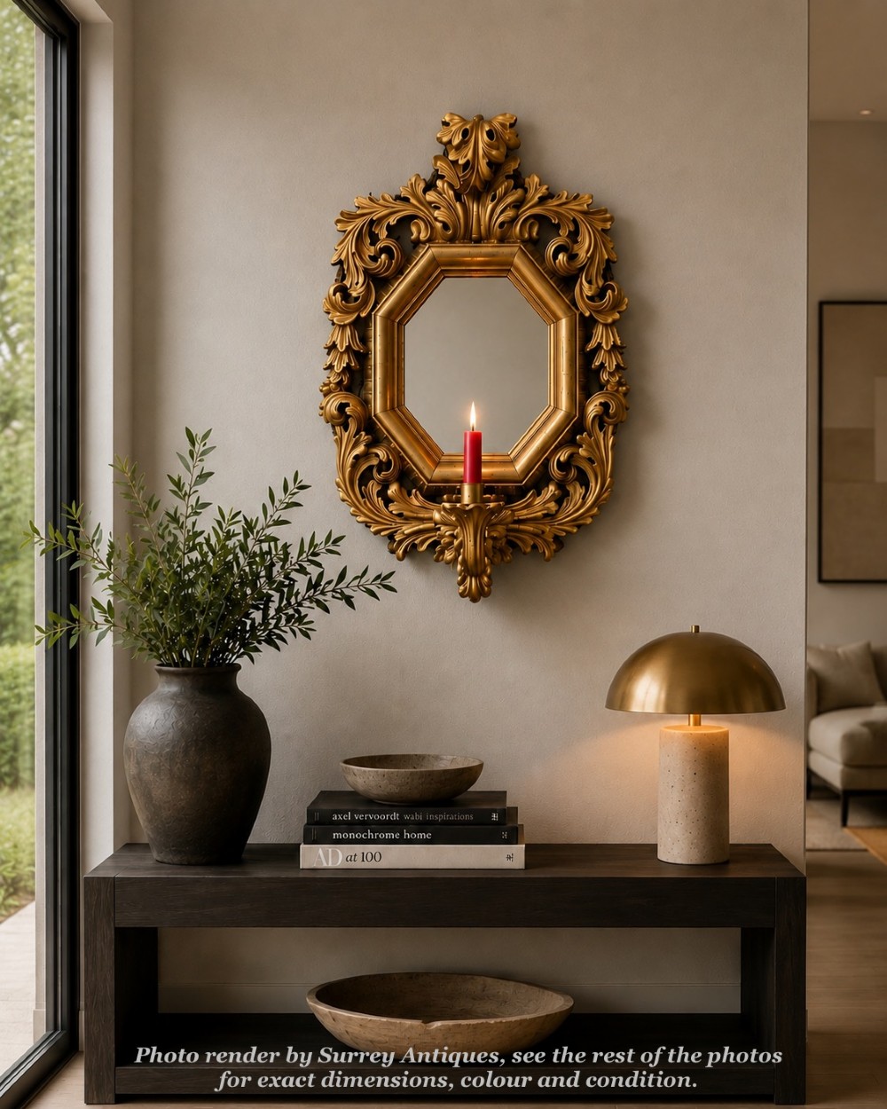 An octagonal 19th-century French giltwood girandole wall mirror featuring carved acanthus leaf motifs and an integrated central candle sconce holding a single candle.