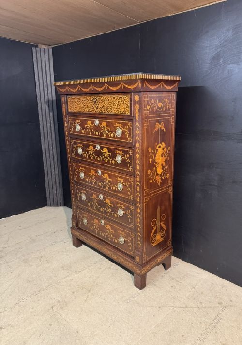 An 18th-century Dutch mahogany tall chest of drawers featuring intricate floral marquetry inlay across six drawers with brass handles. View V