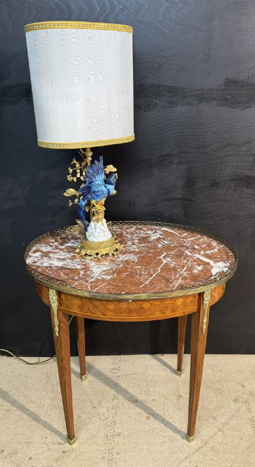 An oval French side table featuring a red veined marble top with a pierced brass gallery, geometric parquetry apron, and four tapered legs adorned with brass mounts. View II
