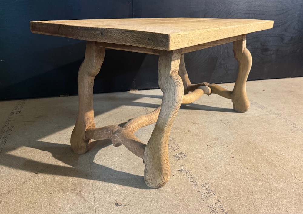 A rectangular low French oak coffee table with curved splayed legs and a contoured central stretcher. View IV