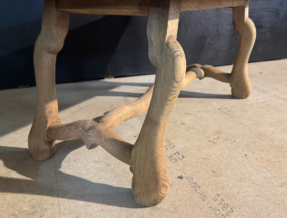 A rectangular low French oak coffee table with curved splayed legs and a contoured central stretcher. View V