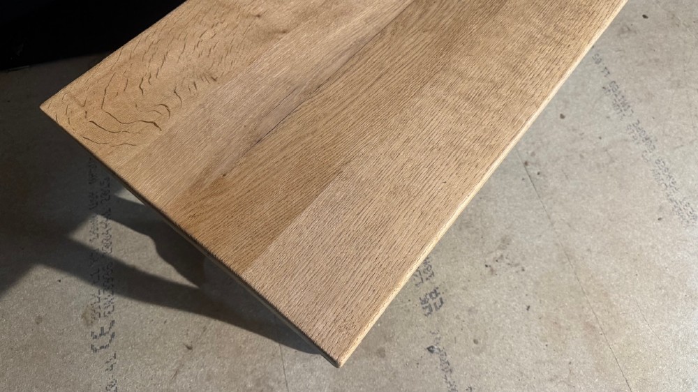 A rectangular low French oak coffee table with curved splayed legs and a contoured central stretcher. View IX
