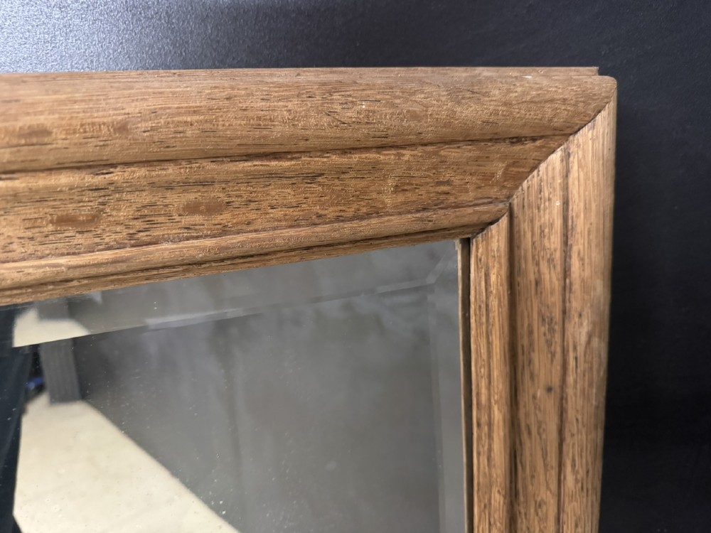A large rectangular 19th-century French wall mirror with a moulded natural oak frame and a bevelled glass plate. View V