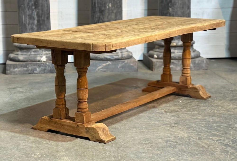 A rectangular French oak dining table featuring a parquetry top, twin turned pedestal legs, and a low central stretcher base. View VIII