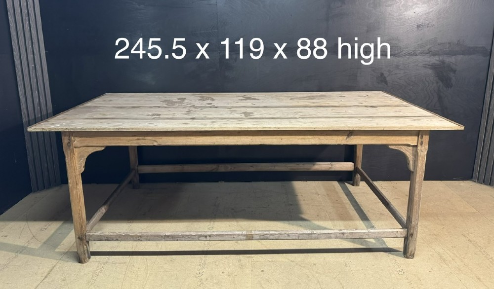 A large rustic wooden French prep table featuring a weathered scrubbed timber top, corner support brackets, and low perimeter stretchers. View III