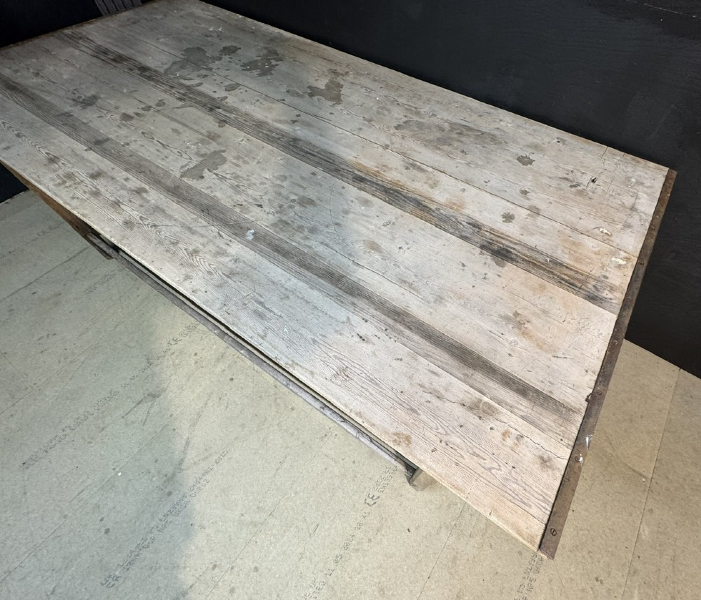 A large rustic wooden French prep table featuring a weathered scrubbed timber top, corner support brackets, and low perimeter stretchers. View VII