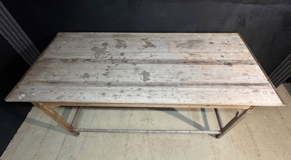 A large rustic wooden French prep table featuring a weathered scrubbed timber top, corner support brackets, and low perimeter stretchers. View XI