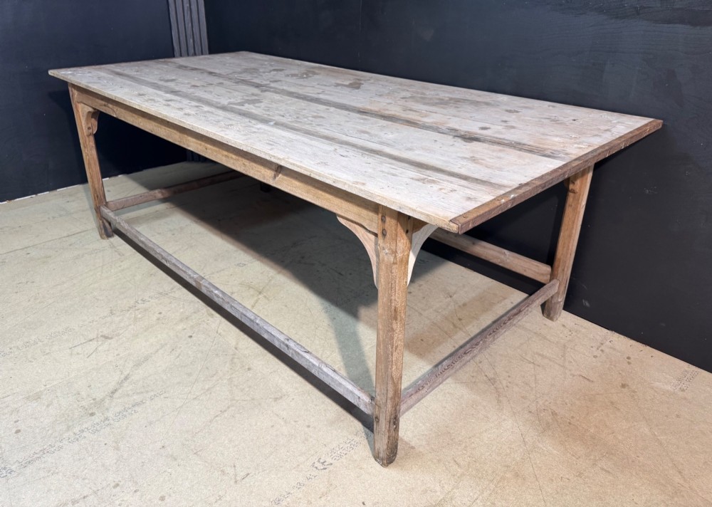 A large rustic wooden French prep table featuring a weathered scrubbed timber top, corner support brackets, and low perimeter stretchers. View XII