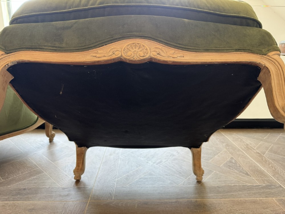 A pair of French wingback armchairs upholstered in olive green velvet with carved timber frames and cabriole legs. View XI