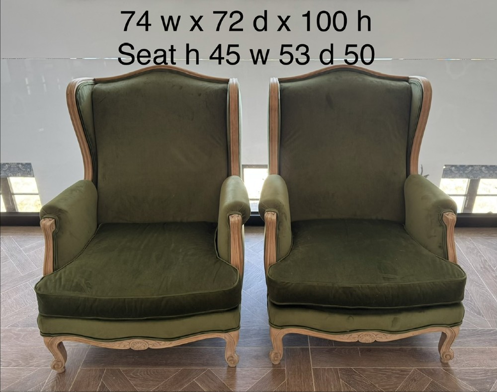 A pair of French wingback armchairs upholstered in olive green velvet with carved timber frames and cabriole legs. View XIII