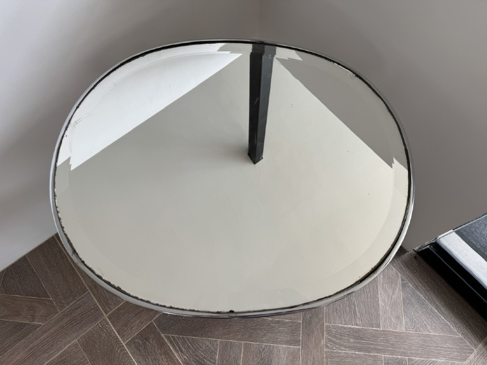 A circular chrome Art Deco side table featuring a mirrored glass top, Greek key frieze pattern, lower tier mirror, and scroll-footed legs. View V