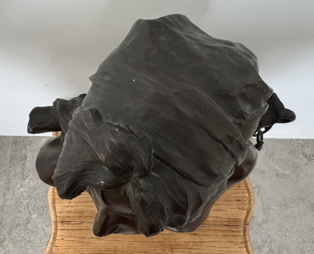 A late 19th-century Art Nouveau patinated bronze bust of a female captive figure by Emmanuel Villanis. View VIII